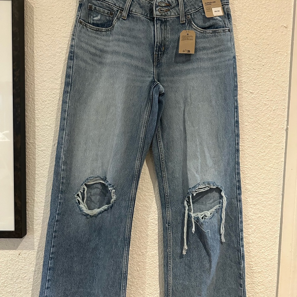 Levi's Light Wash Ripped Straight Leg Jeans